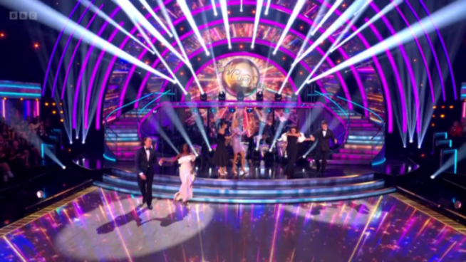 Strictly Come Dancing stage with dancers and judges.