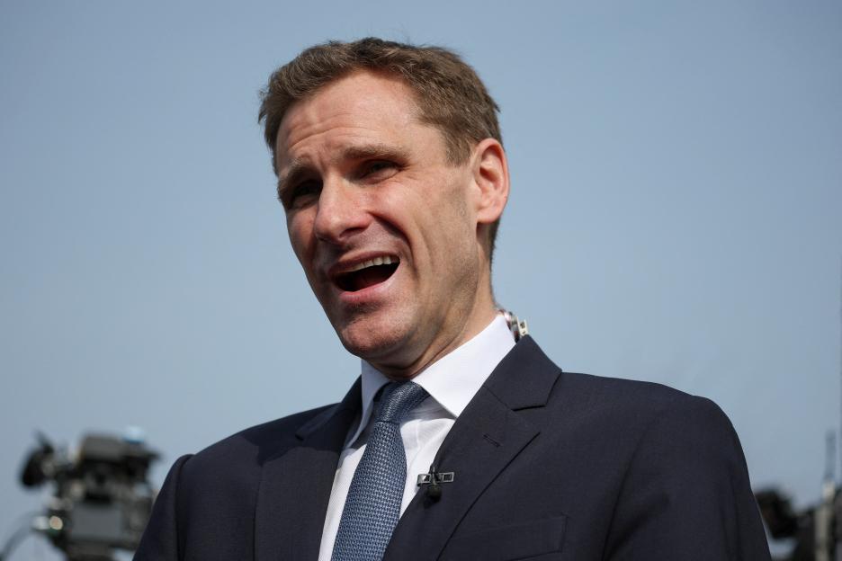 British Shadow Home Secretary Chris Philp speaks to the media.