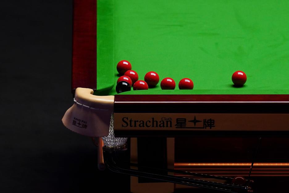 Sheffield, UK. 01st May, 2026. The black ball and red balls near the corner pocket during frame 14 of the match between Mark Allen of Northern Ireland and Wu Yize of China during the Semi-Final of the Halo World Snooker Championship 2026 at The Cruci