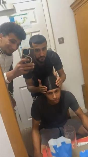 Three men, Ibrahim Alshafe, Abdullah Ahmadi, and Karin Al-Danasurt, preparing to go to Brighton Beach.