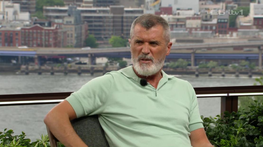A man with a gray beard and short gray hair wearing a light green polo shirt.