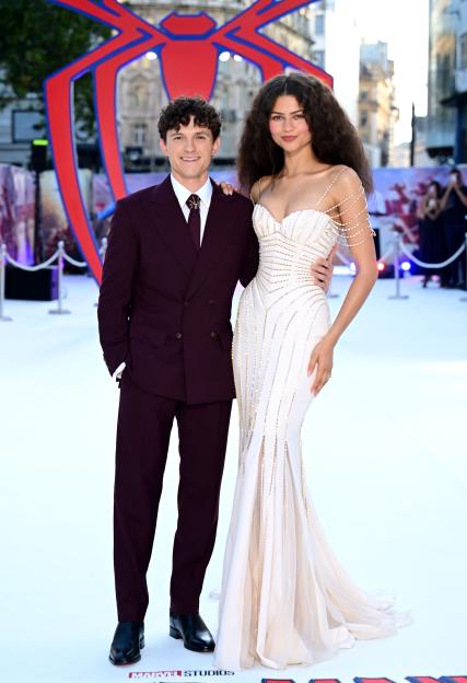 Tom Holland and Zendaya pose for a photo at the "Spider-Man Brand New Day" film premiere.