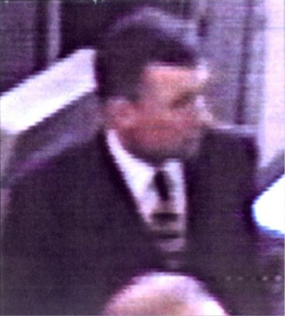 CCTV image of an unidentified man in a suit and tie, who may be connected to the Jill Dando murder case.