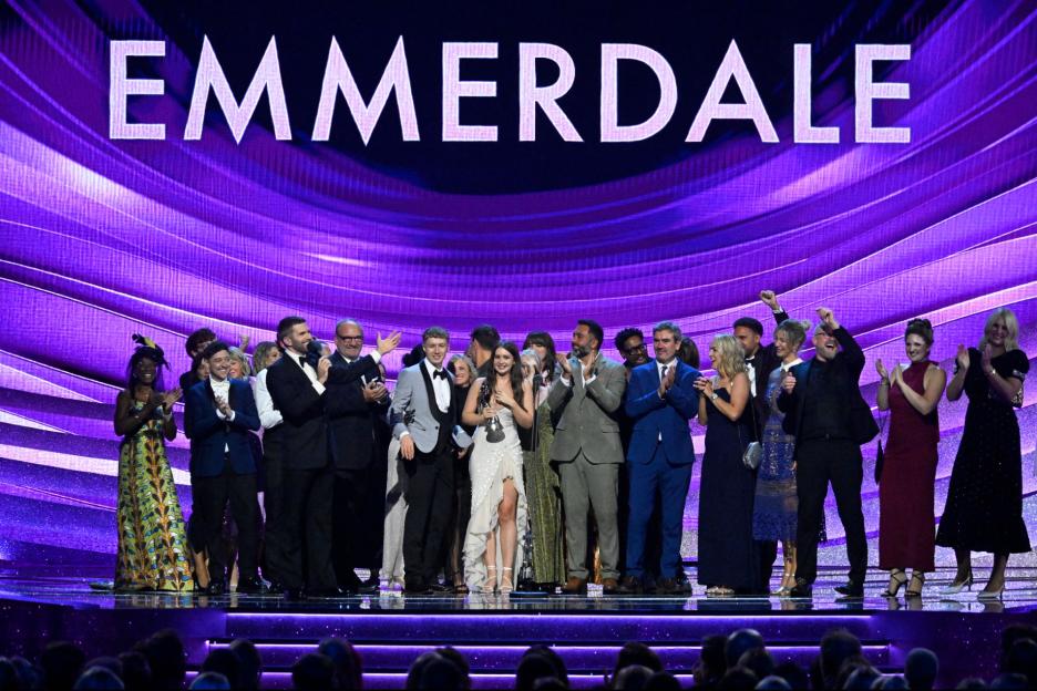 An image collage containing 1 images, Image 1 shows The cast of 'Emmerdale' accepting the 'Serial Drama' award at the National Television Awards 2026