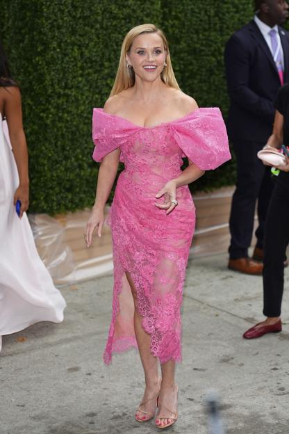Reese Witherspoon arriving at the premiere of "Elle" in a pink lace dress.