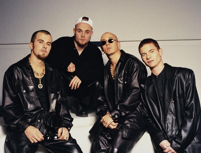 English pop group East 17, from left to right: Terry Coldwell, Brian Harvey, John Hendy and Tony Mortimer, posing in black leather outfits.