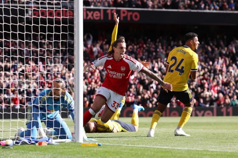 Riccardo Calafiori of Arsenal celebrates after scoring a goal against Leeds United at Emirates Stadium.