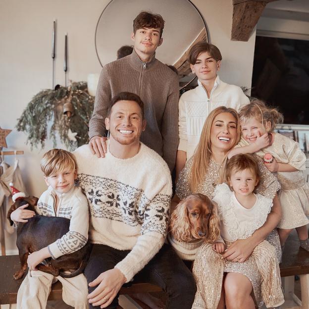 Stacey Solomon and Joe Swash with their children and two dogs dressed for Christmas.