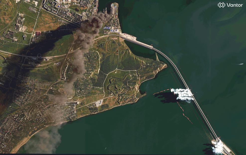 Satellite image shows burning oil storage tanks and smoke rising from the Crimea Bridge