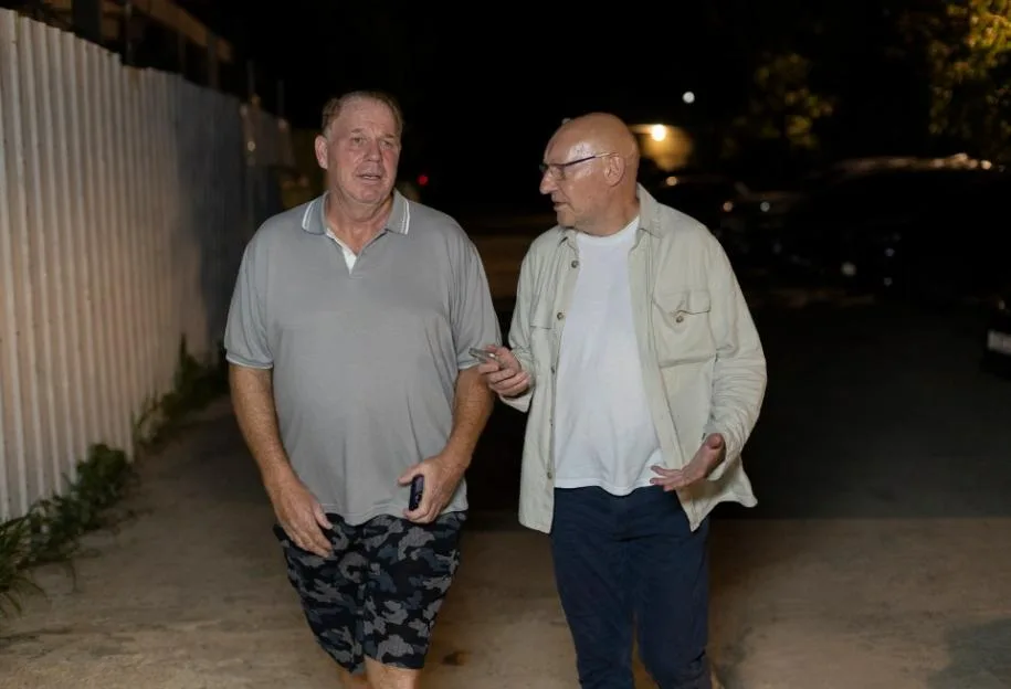 Thomas Markle Jnr walking at night in Cebu, Philippines, with journalist Nick Parker.