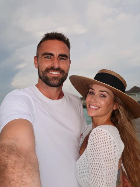 Laura Anderson and Clark Robertson posing for a selfie during a holiday.