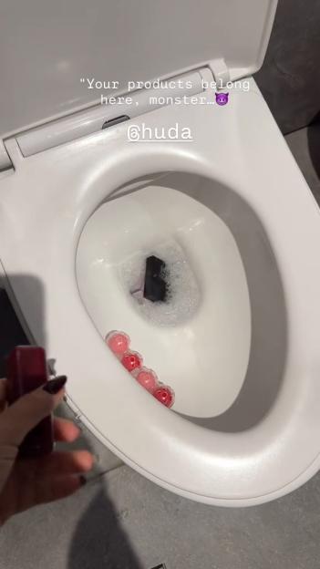 Beauty products being destroyed in a toilet.