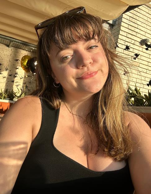 Cyann Fielding smiling at the camera outdoors.