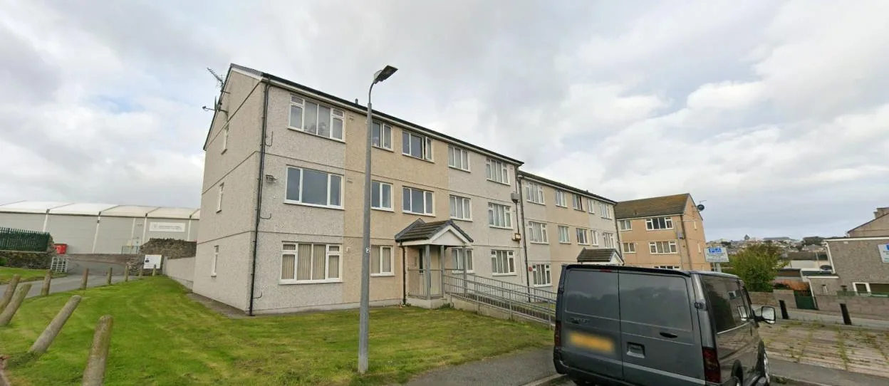 Body of man, 53, found inside flat in UK port town in early hours – as man, 33, arrested