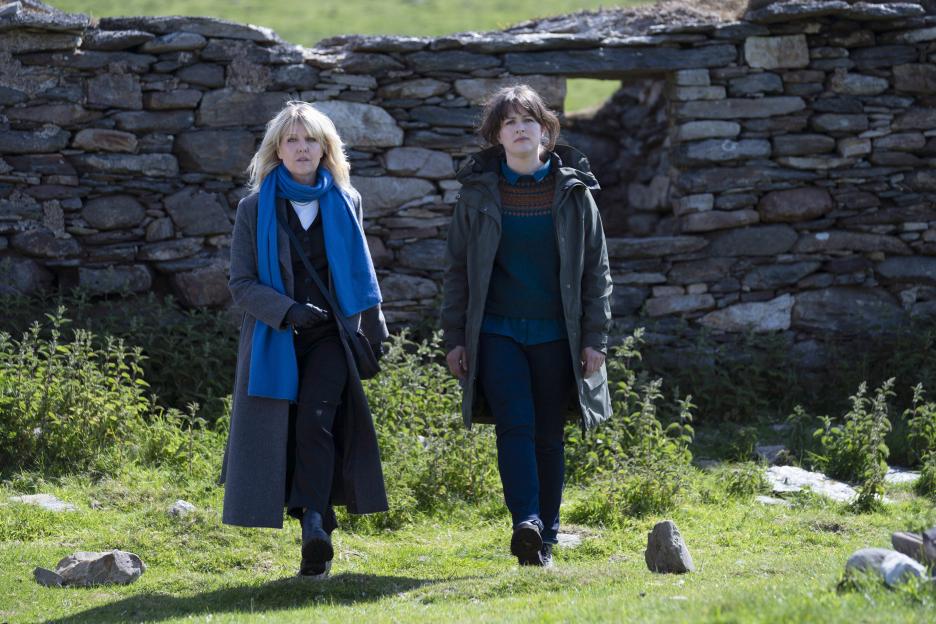DI Ruth Calder (Ashley Jensen) and DI Tosh McIntosh (Alison O'Donnell) from the ITV series Shetland, walking outdoors.