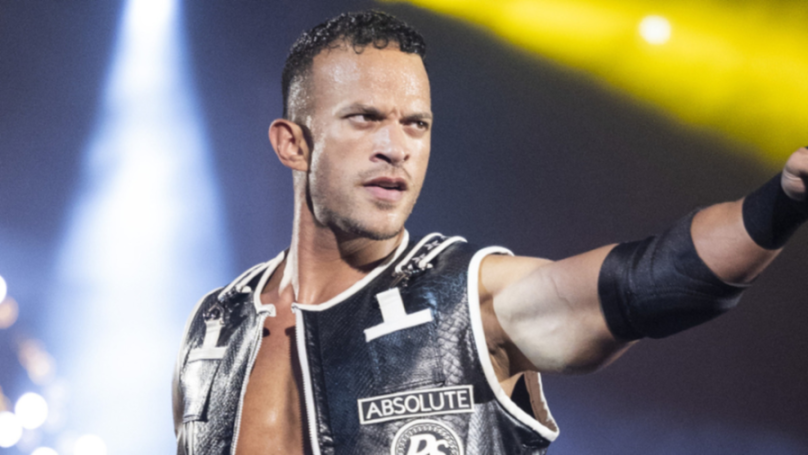 Pro wrestler Ricky Starks wearing a black and white vest with "ABSOLUTE" written on it.