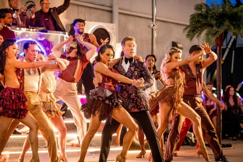 Katya Jones, Anton Du Beke, and other professional dancers performing at an event.