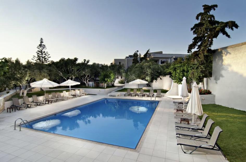 The swimming pool area at Ourania Apartments.