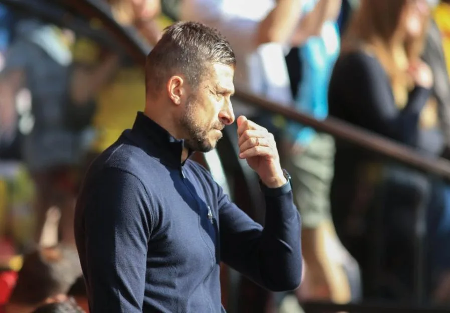 Watford manager Alessio Dionisi watching the match from the touchline.