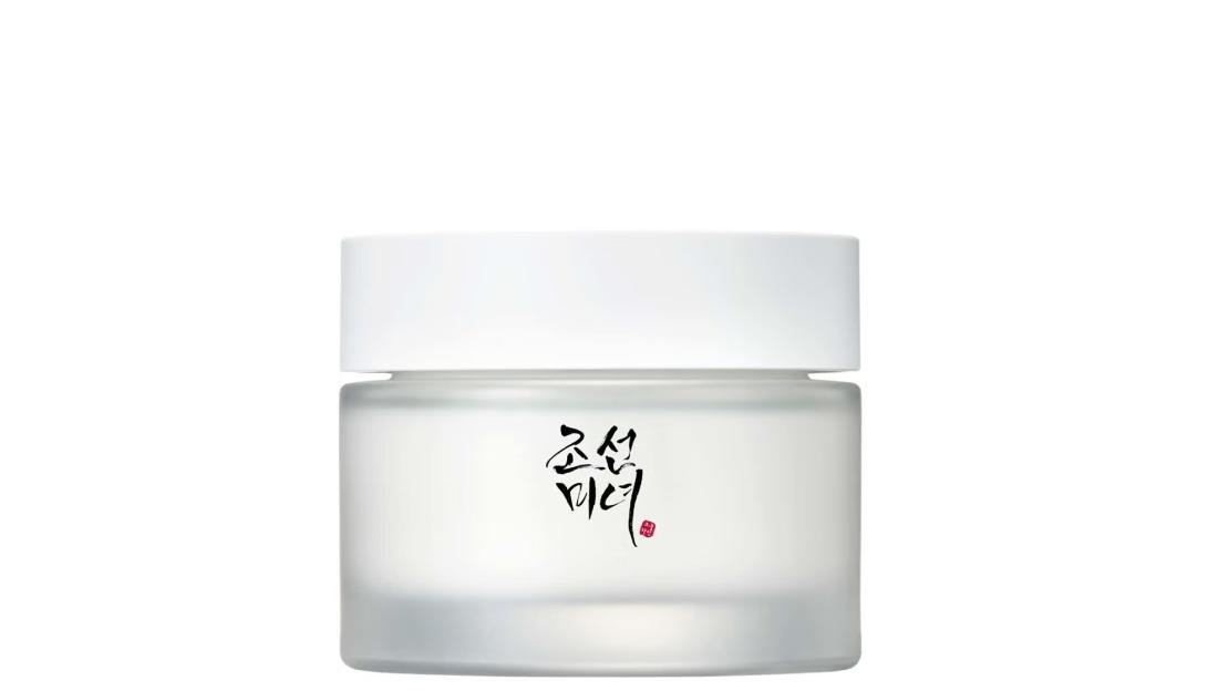 White jar with Korean text on the front.