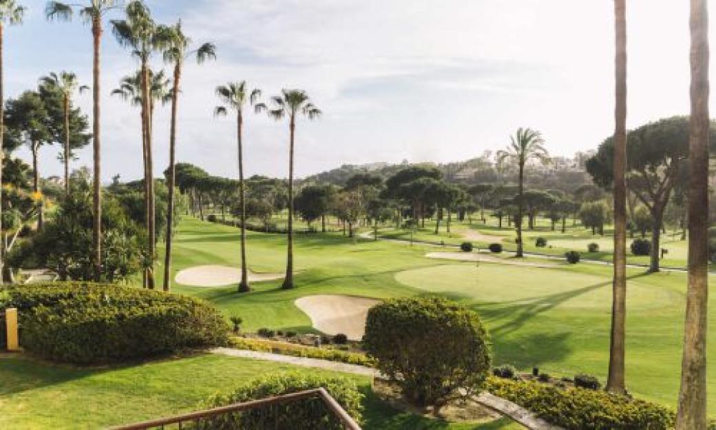 Rio Real golf course in Mallorca with palm trees and sand traps.