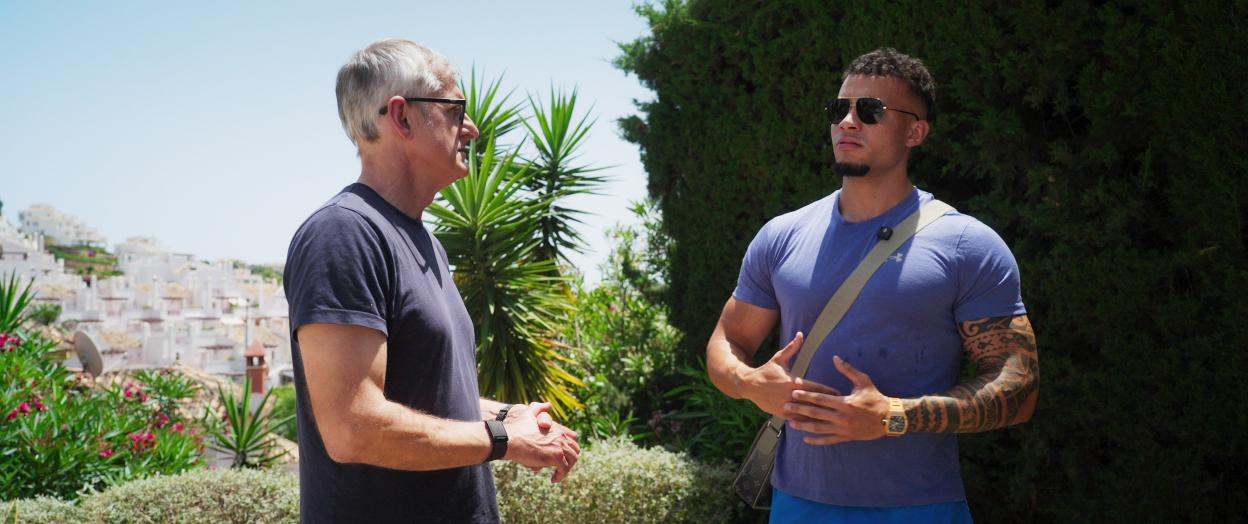 Louis Theroux and Harrison Sullivan (HS Tikky Tokky) talking outside.