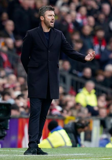 Michael Carrick, manager of Manchester United, on the sidelines during a Premier League match.