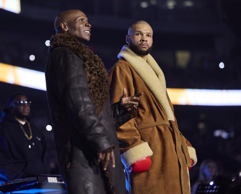 Chris Eubank Jr. and his father Chris Eubank Sr. during a ring walk.