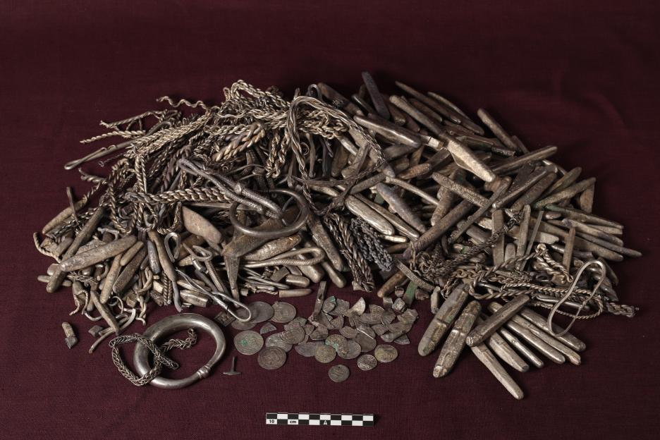A hoard of silver Viking artifacts, including bracelets, coins, and silver bars.