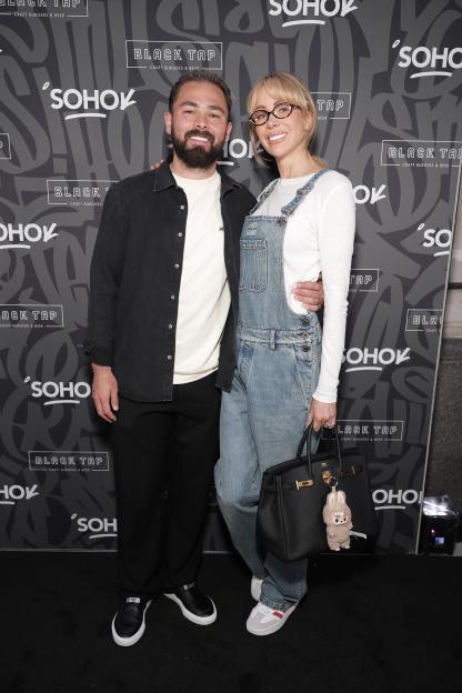 Bradley Dack and Olivia Attwood posing for a photo at the Black Tap UK launch party.