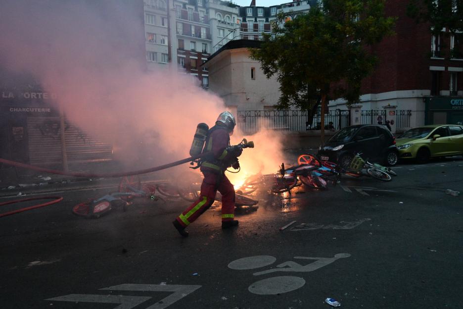 Paris Saint-Germain supporters celebrate their team's championship title in Paris