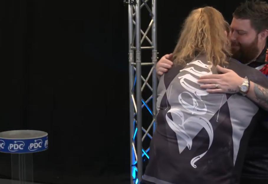 Beau Greaves being embraced after becoming the first woman to win a Players Championship title.