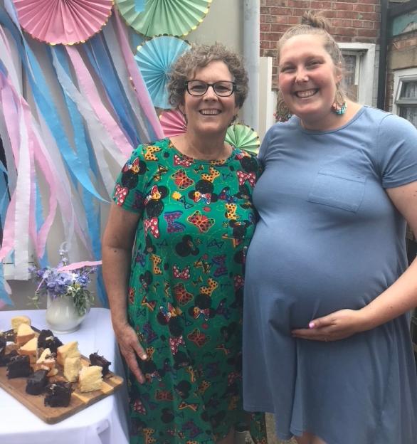 Greer Jones, 34, a pregnant podcaster, and her mother standing outdoors.