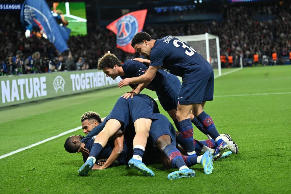 PSG players celebrate a goal during a UEFA Champions League match.