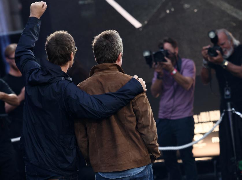 Liam and Noel Gallagher posing for photographers at the UK premiere of "Oasis: Don't Look Back In Anger".