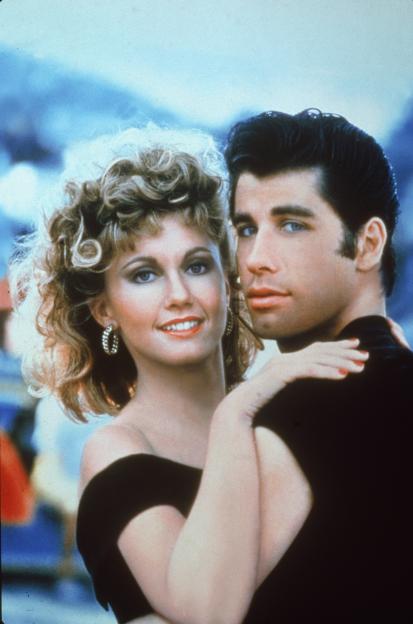 John Travolta and Olivia Newton-John embrace in a promotional still for the film, 'Grease.'