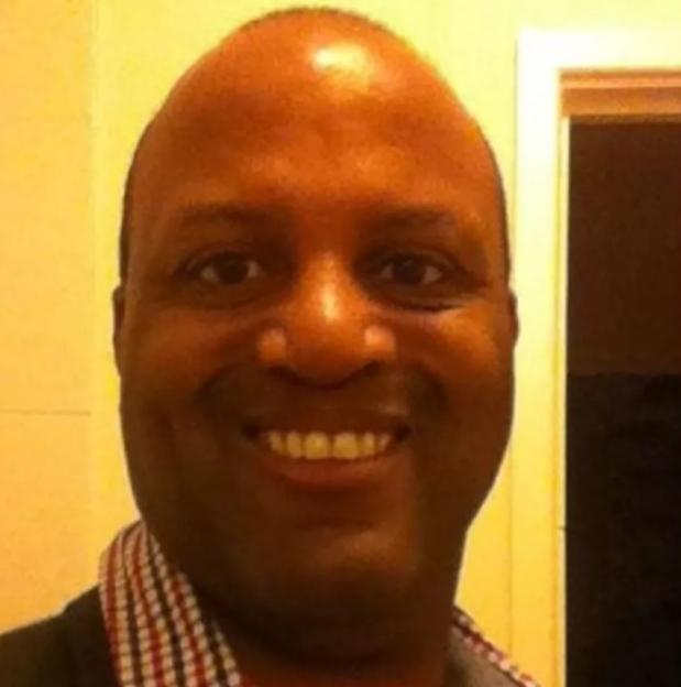 Raymond Williams, 61, smiling.