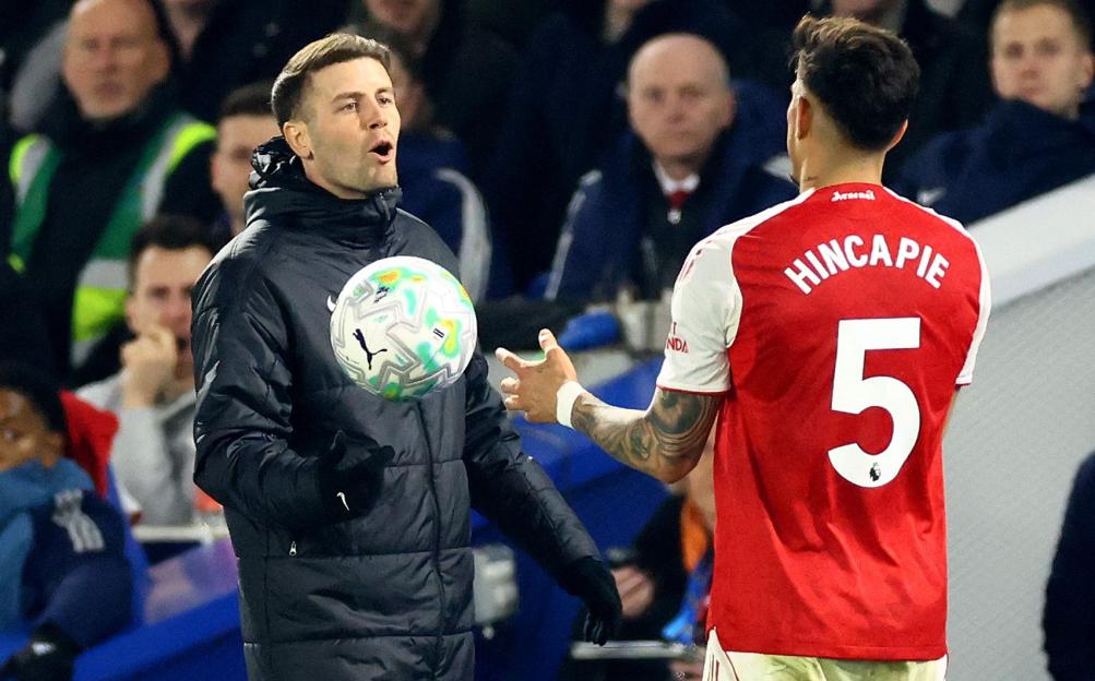 Brighton and Hove Albion Manager Fabian Hurzeler speaks with Piero Hincapie of Arsenal during a football match.