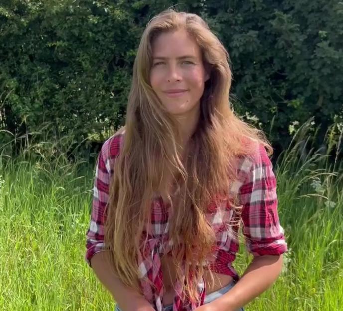 Hannah Bourne-Taylor standing in a field.