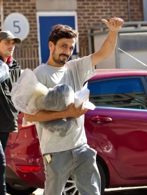 Prisoners emerge from jail after being released under a government early release scheme from Pentonville Prison , London. This is Wassem Akhmed, 44