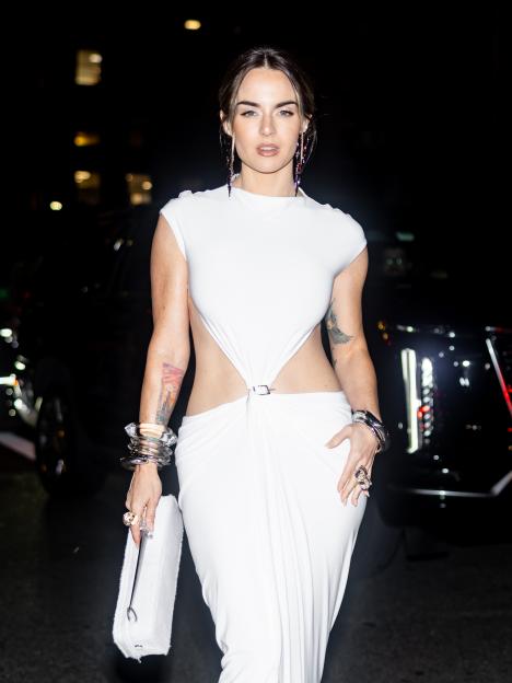 Noughties pop star looks unrecognisable as she flashes toned tum & tattoos at New York Fashion Week – can you guess who?