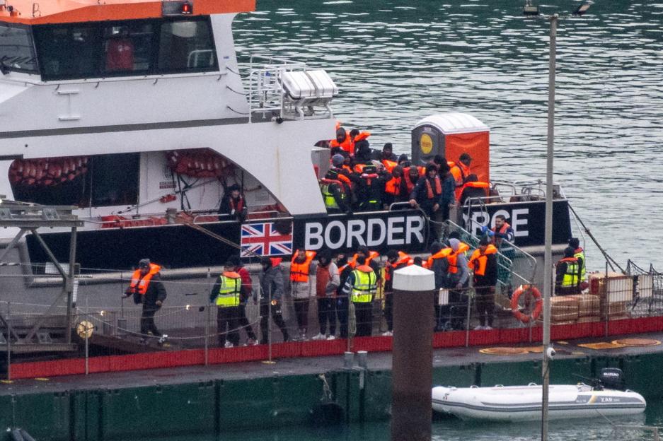 : Migrants arrive in the UK after crossing the English Channel