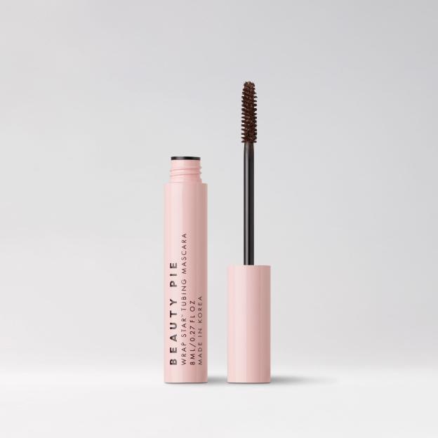 Beauty Pie Wrap Star Tubing Mascara in a pale pink tube with the wand next to it.
