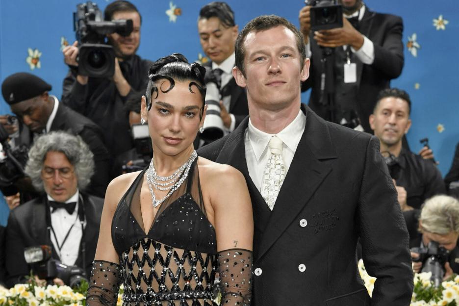 Dua Lipa and Callum Turner attending The Metropolitan Museum of Art's Costume Institute benefit gala.