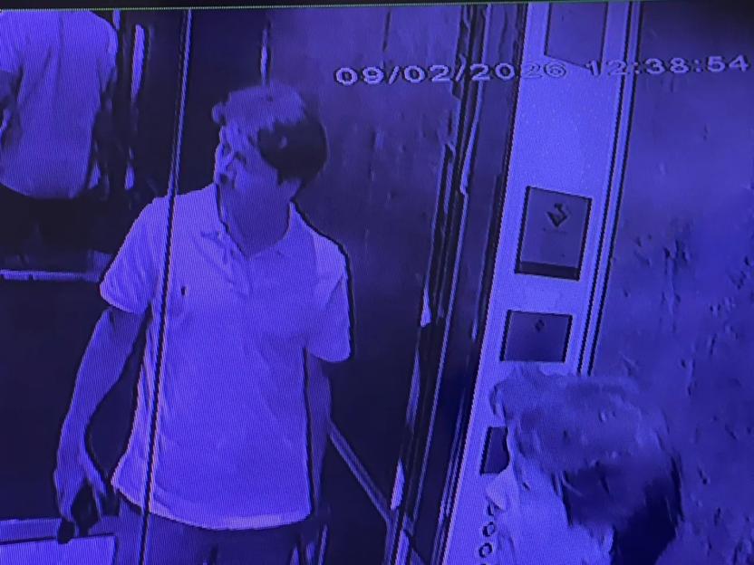 A man in a polo shirt on a CCTV image, taken from a security camera.