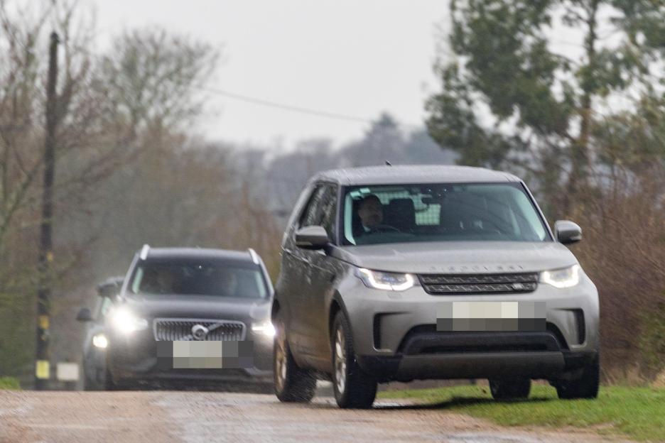 Police vehicles arriving at Wood Farm on the Sandringham Estate in Norfolk.
