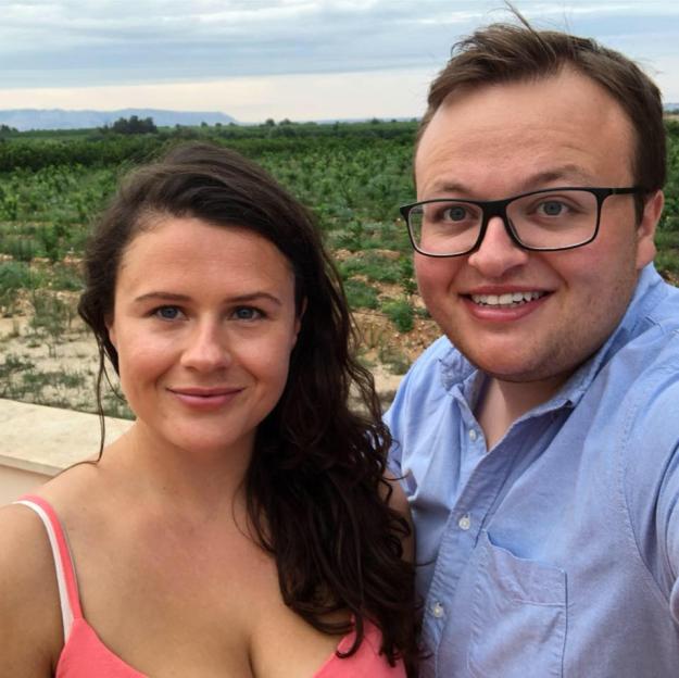 David Taylor and Joani Reid smiling for a selfie.