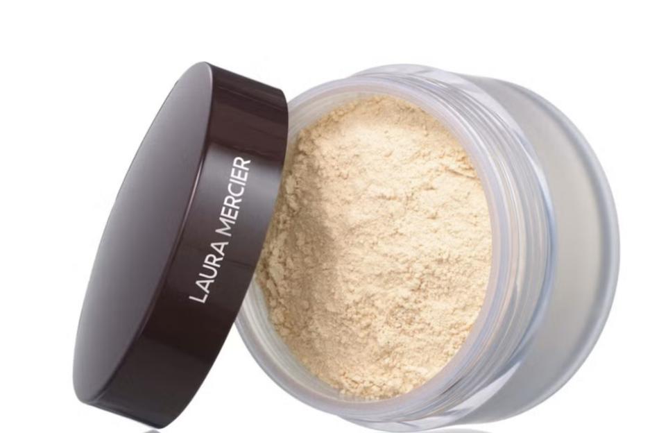 Laura Mercier setting powder in an open container.