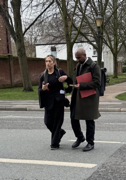 Sana Aslim, a beautician, and her lawyer, Mr. Adil Khan, walking on a street.