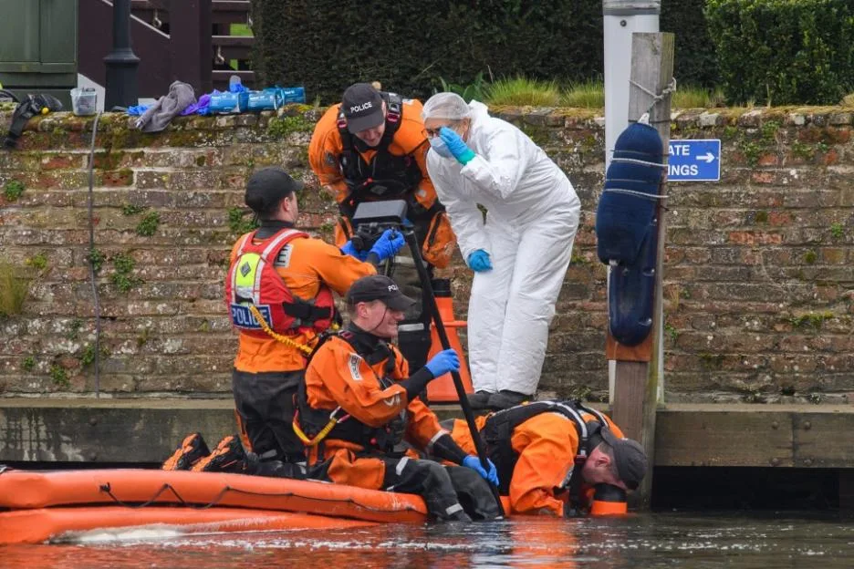 Police search the River Thames for evidence.